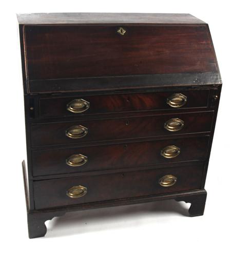 Appraisal: A late George III mahogany bureau the fall front enclosing