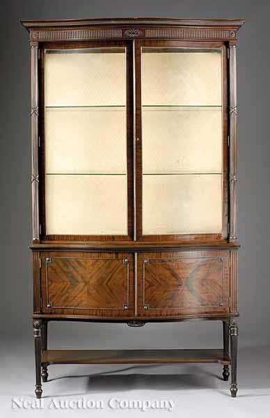 Appraisal: An Edwardian Mahogany China Cabinet c serpentine molded cornice fluted