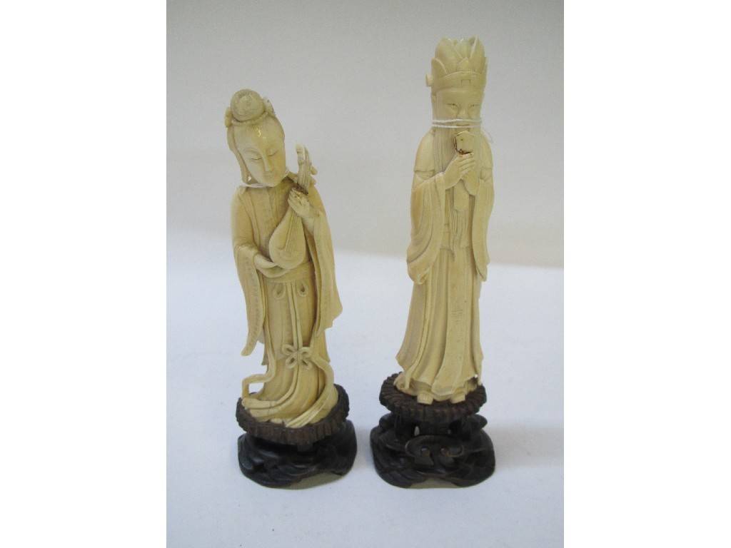 Appraisal: Lot comprising two carved ivory figures - female musician and