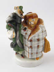 Appraisal: A Russian ceramic humorous group of a fox escorting her