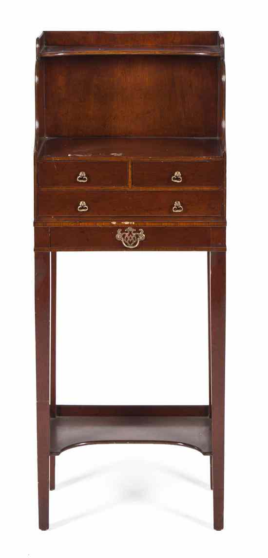 Appraisal: A Georgian Style Mahogany Washstand having two shelves above two