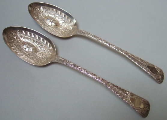 Appraisal: A pair of Victorian silver serving spoons the handles and