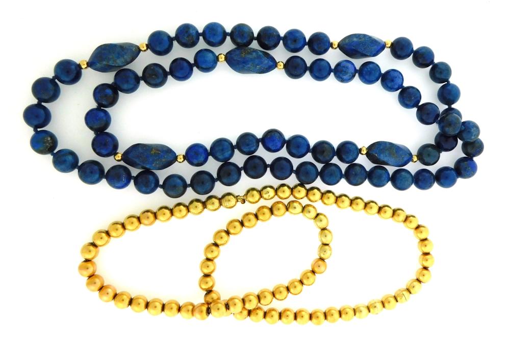 Appraisal: JEWELRY Two bead necklaces one lapis one gold beads including