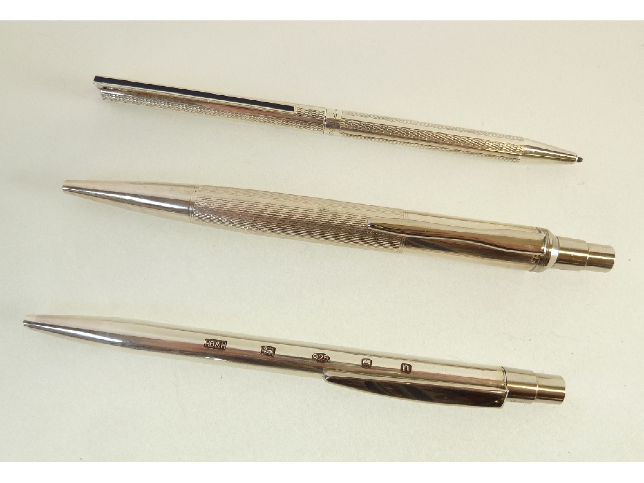 Appraisal: TWO HALLMARKED SILVER BALLPOINT PENS by Harrison Borthers and Howson