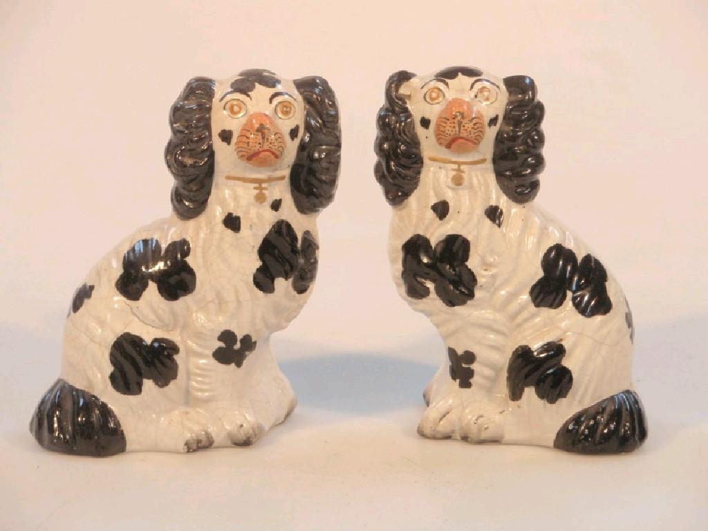 Appraisal: A small pair of Victorian Staffordshire King Charles spaniel 'comforter