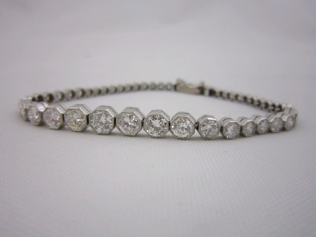 Appraisal: A graduated Diamond Tennis Bracelet collet-set brilliant-cut stones estimated total