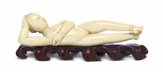 Appraisal: An Ivory Doctor's Model depicting the recumbent figure with carved