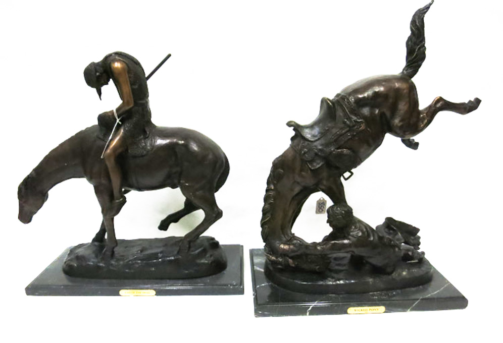 Appraisal: TWO PATINATED BRONZE SCULPTURES after Remington depicting men on horseback