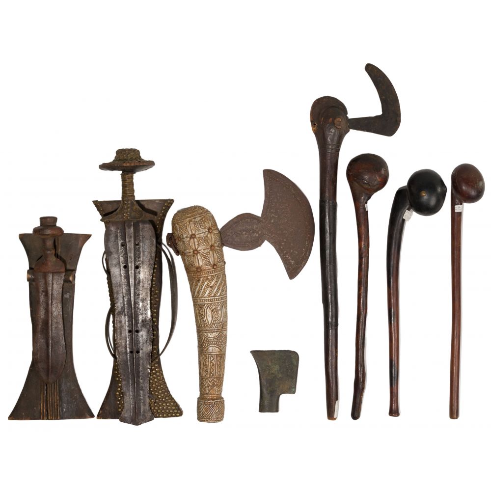 Appraisal: AFRICAN WEAPON ASSORTMENT items including swords daggers having wide symmetrical