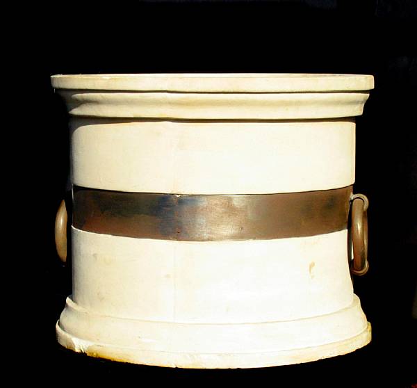 Appraisal: A Kneedler-Fauchere contemporary reconstituted stone planter with metal strap details