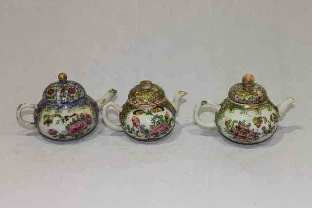 Appraisal: A COLLECTION OF THREE MINIATURE CANTON PORCELAIN TEAPOTS each with