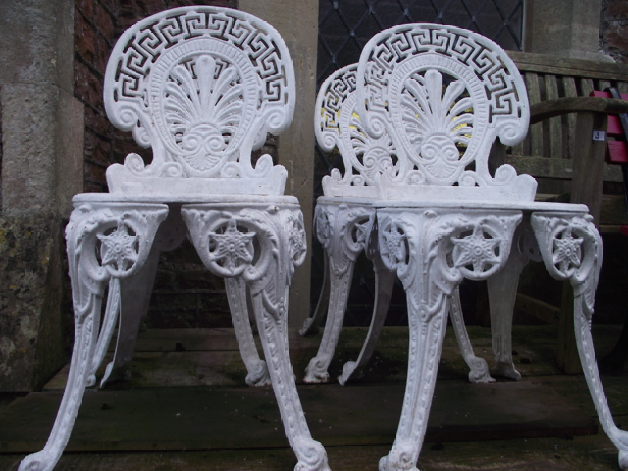 Appraisal: A set of four good quality cast iron garden chairs