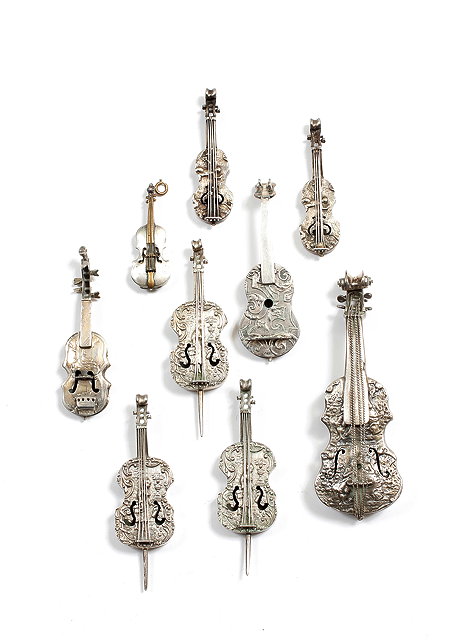 Appraisal: A GROUP OF CONTINENTAL WHITE METAL MINIATURE MUSICAL INSTRUMENTS the