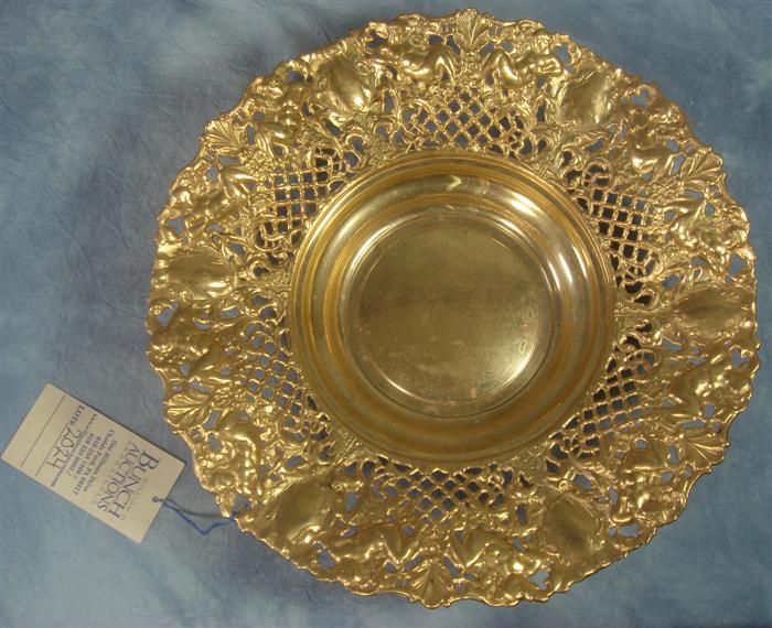 Appraisal: Stamped brass repousse center bowl pierced cherub border d marked