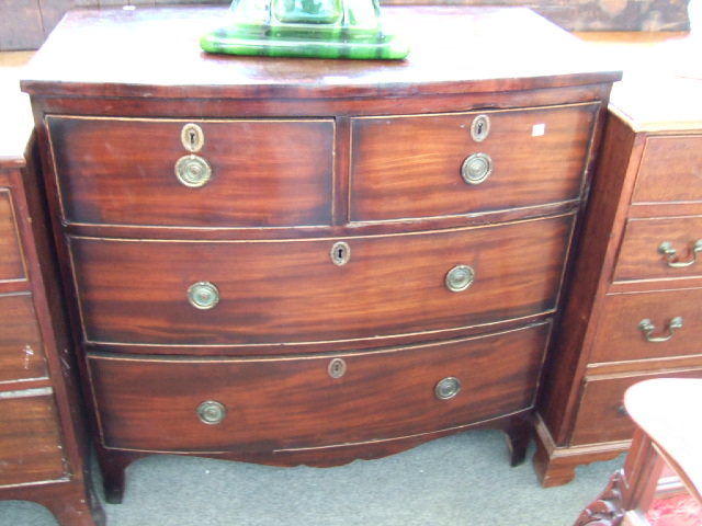 Appraisal: A th century mahogany bowfront chest the crossbanded top over