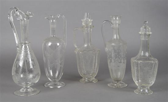 Appraisal: A Collection of Four Etched Glass Ewers Height of tallest