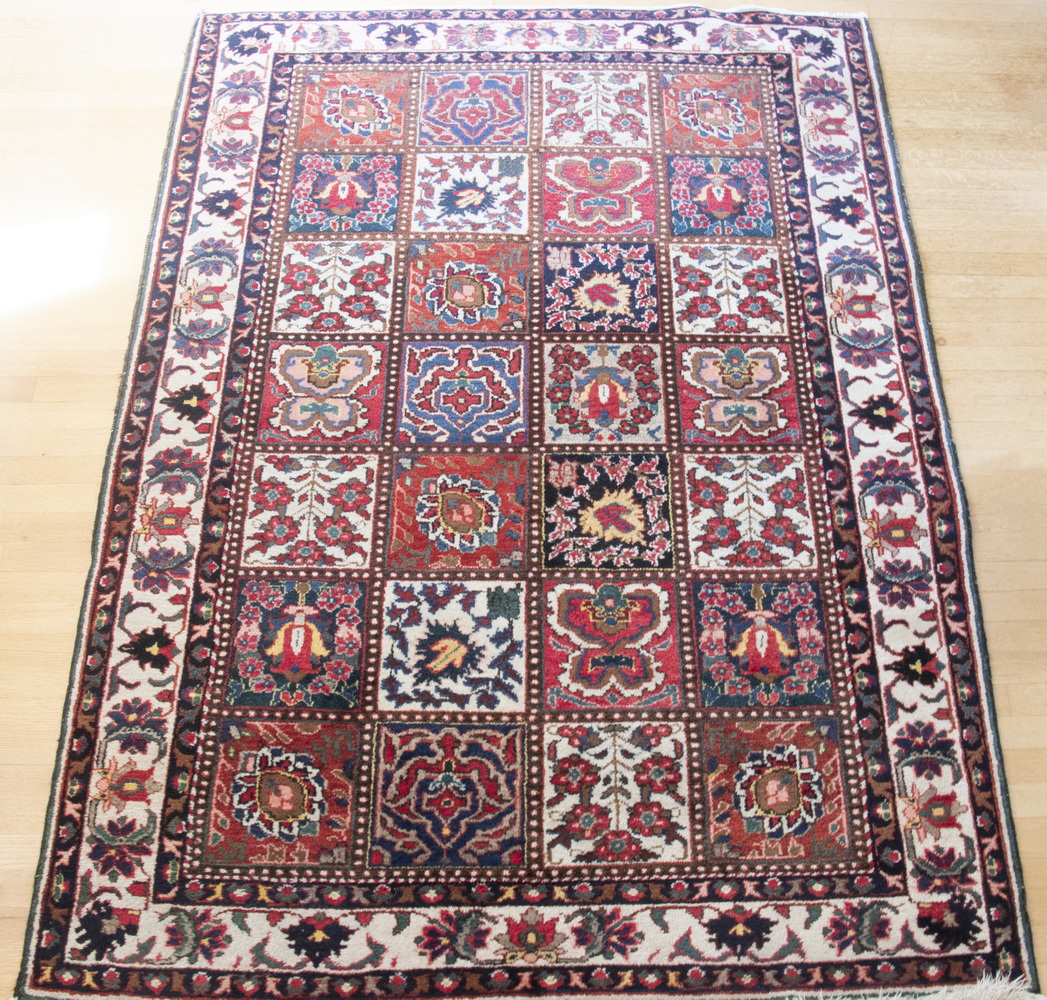 Appraisal: MULTI COLORED SQUARE AREA RUG Medium sized area rug with