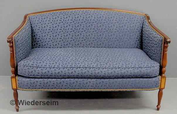 Appraisal: Sheraton style mahogany love seat with reeded legs and blue