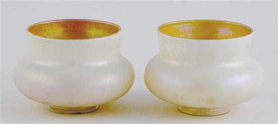 Appraisal: Pair Quezal iridescent glass shades squat vasiform with lustrous white