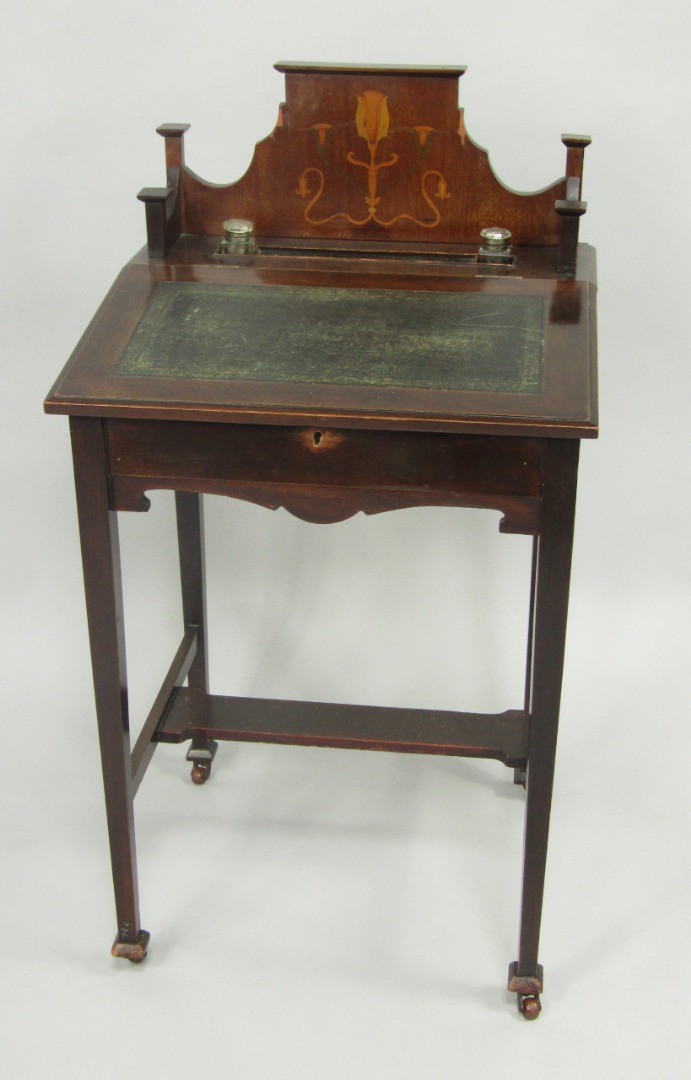 Appraisal: An Art Nouveau mahogany and inlaid lady's desk galleried back