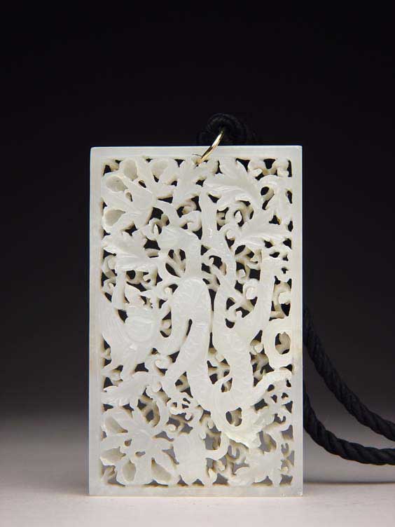 Appraisal: MING WHITE JADE PLAQUE Chinese Ming Dynasty pierce-carved white jade