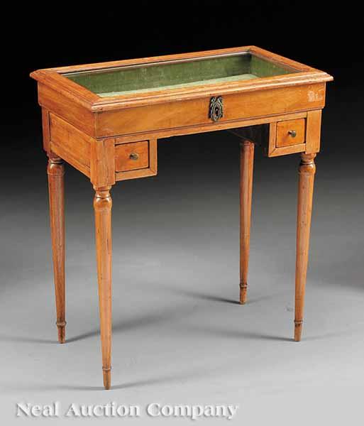 Appraisal: A French Fruitwood Vitrine Table th c the hinged glass