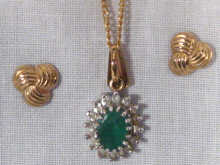 Appraisal: A carat gold emerald and diamond pendant together with a