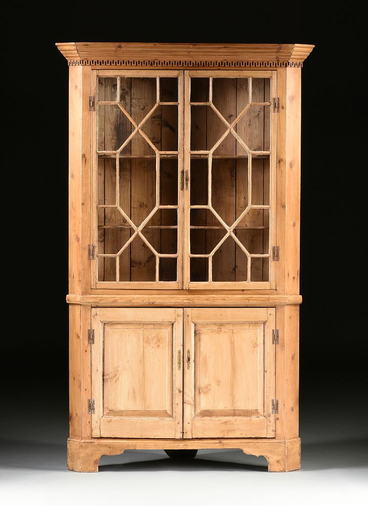 Appraisal: A GEORGE III STYLE WAXED PINE CORNER BOOKCASE CABINET A