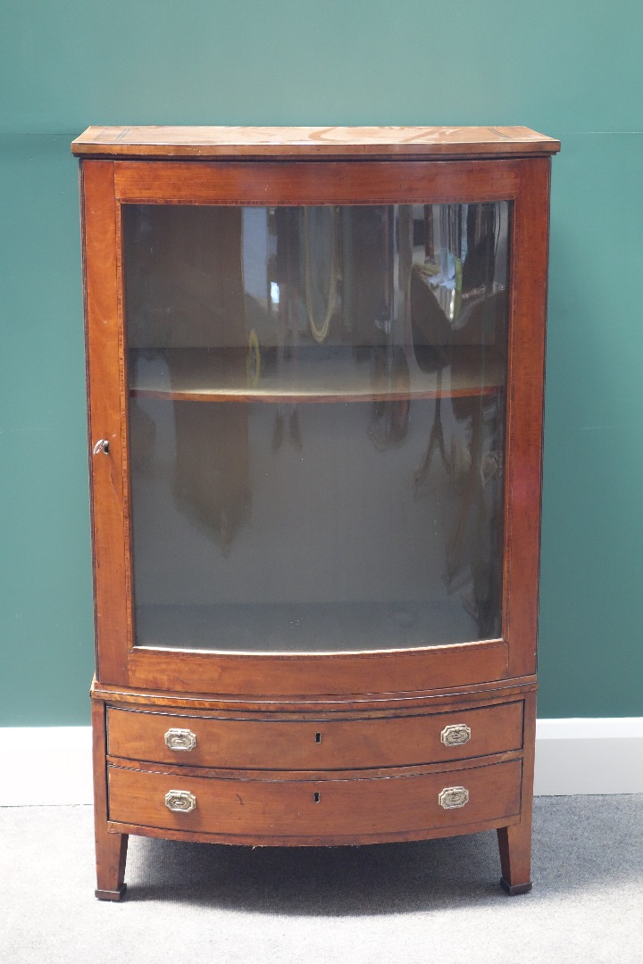 Appraisal: A th century satinwood bow front display cabinet with double