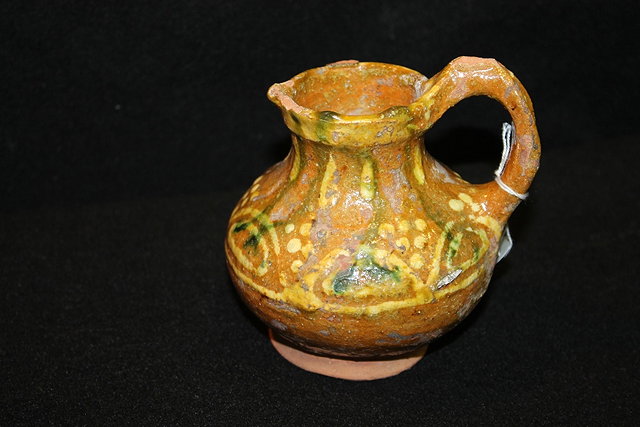 Appraisal: A MEDIEVAL LUSTRE SMALL JUG cm high