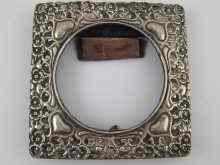 Appraisal: A silver photo frame with pierced and embossed decoration approx