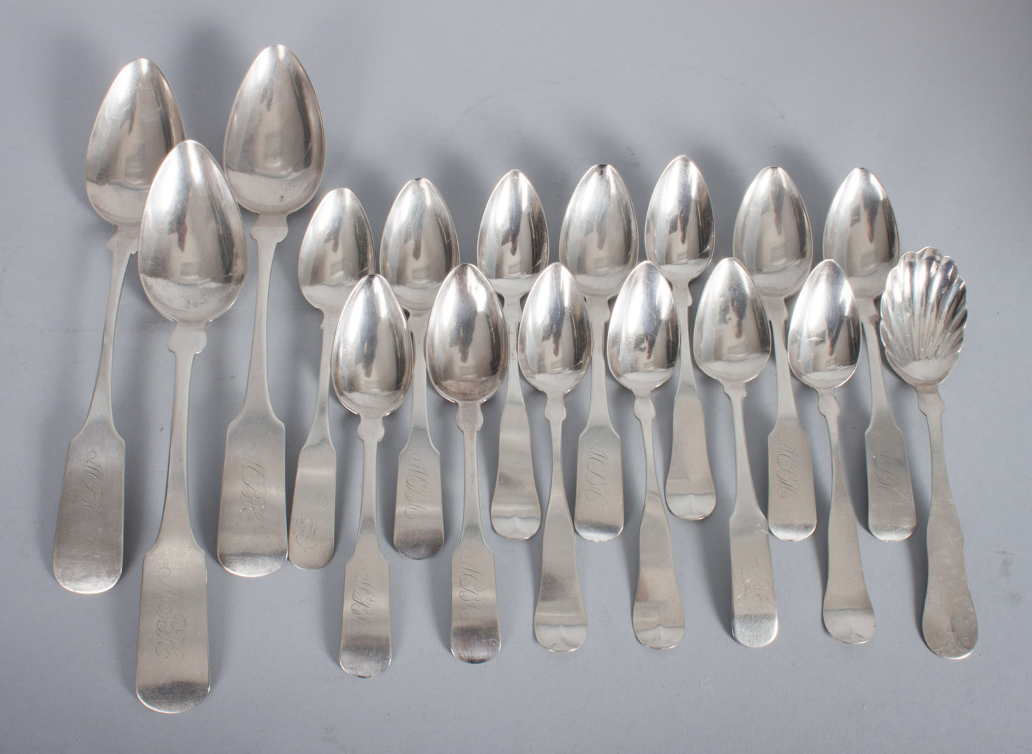 Appraisal: Seventeen Fiddle pattern coin silver spoons th century including tablespoons