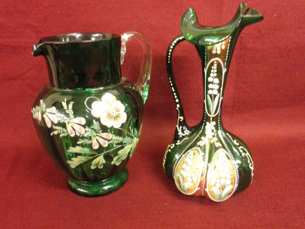 Appraisal: A Victorian green glass jug painted with flowers and a