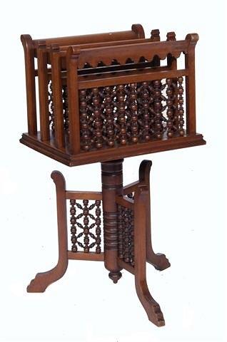 Appraisal: A LATE VICTORIAN WALNUT JOURNAL STAND with four divisions and