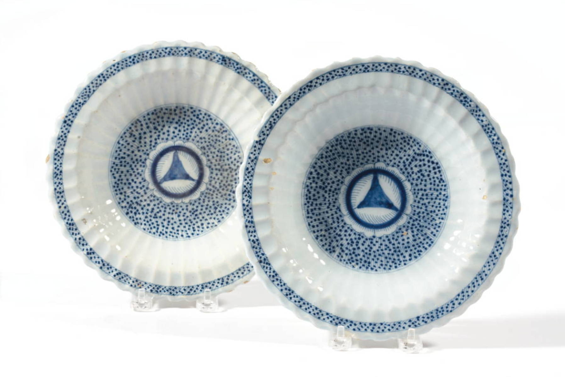 Appraisal: PAIR OF DELFT BLUE AND WHITE FLUTED SOUP PLATES Each