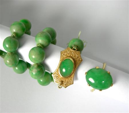 Appraisal: A jade necklace and matching ring the necklace composed of