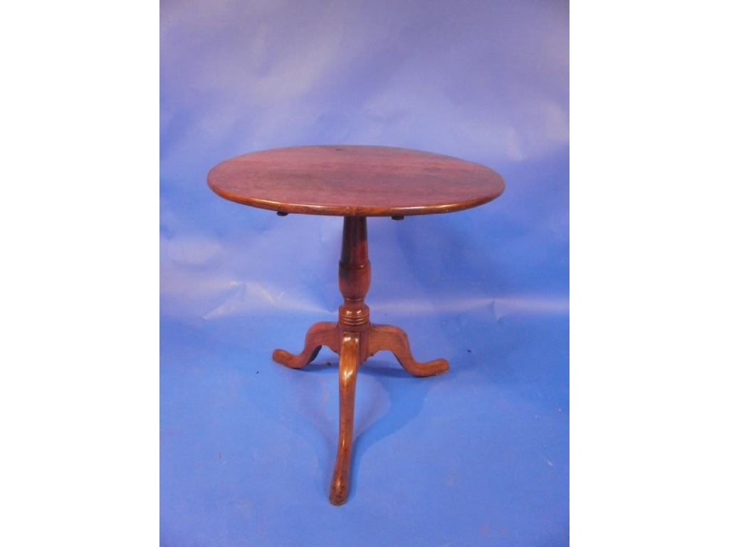 Appraisal: A thC oak tilt top occasional table the circular top