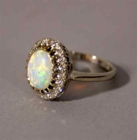 Appraisal: LADY'S WHITE GOLD OPAL AND DIAMOND CLUSTER RING set with