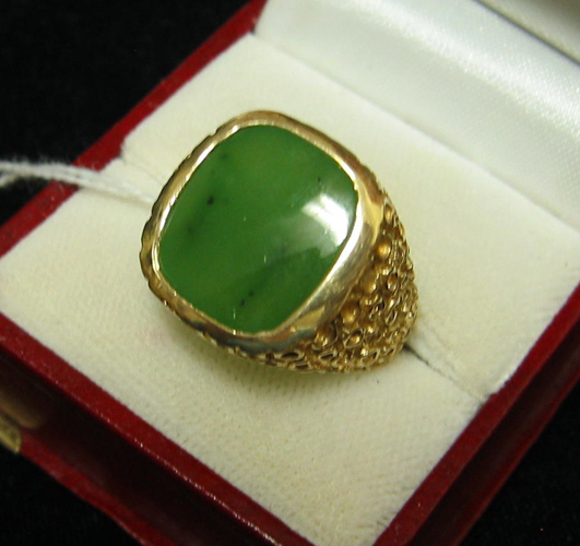 Appraisal: MAN'S JADE AND FOURTEEN KARAT GOLD RING centering a tablet