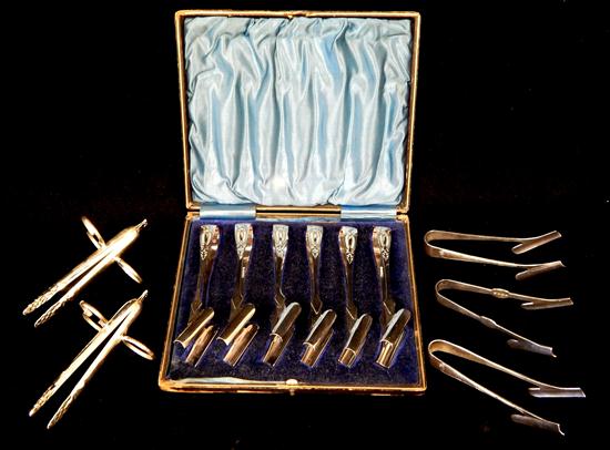 Appraisal: SILVER plate asparagus tongs eleven pieces two matching Elkington plate