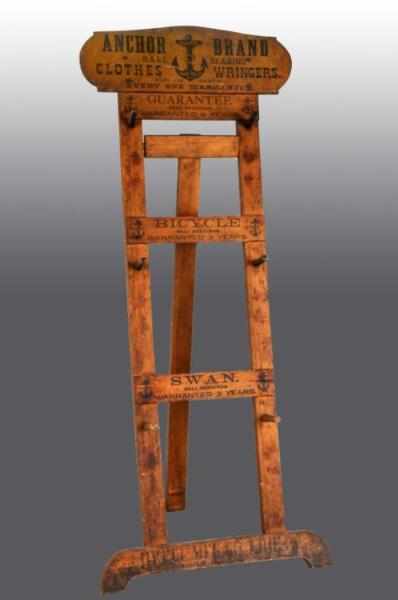 Appraisal: Wooden Anchor Wringer Display Rack Description Includes two sample wringers