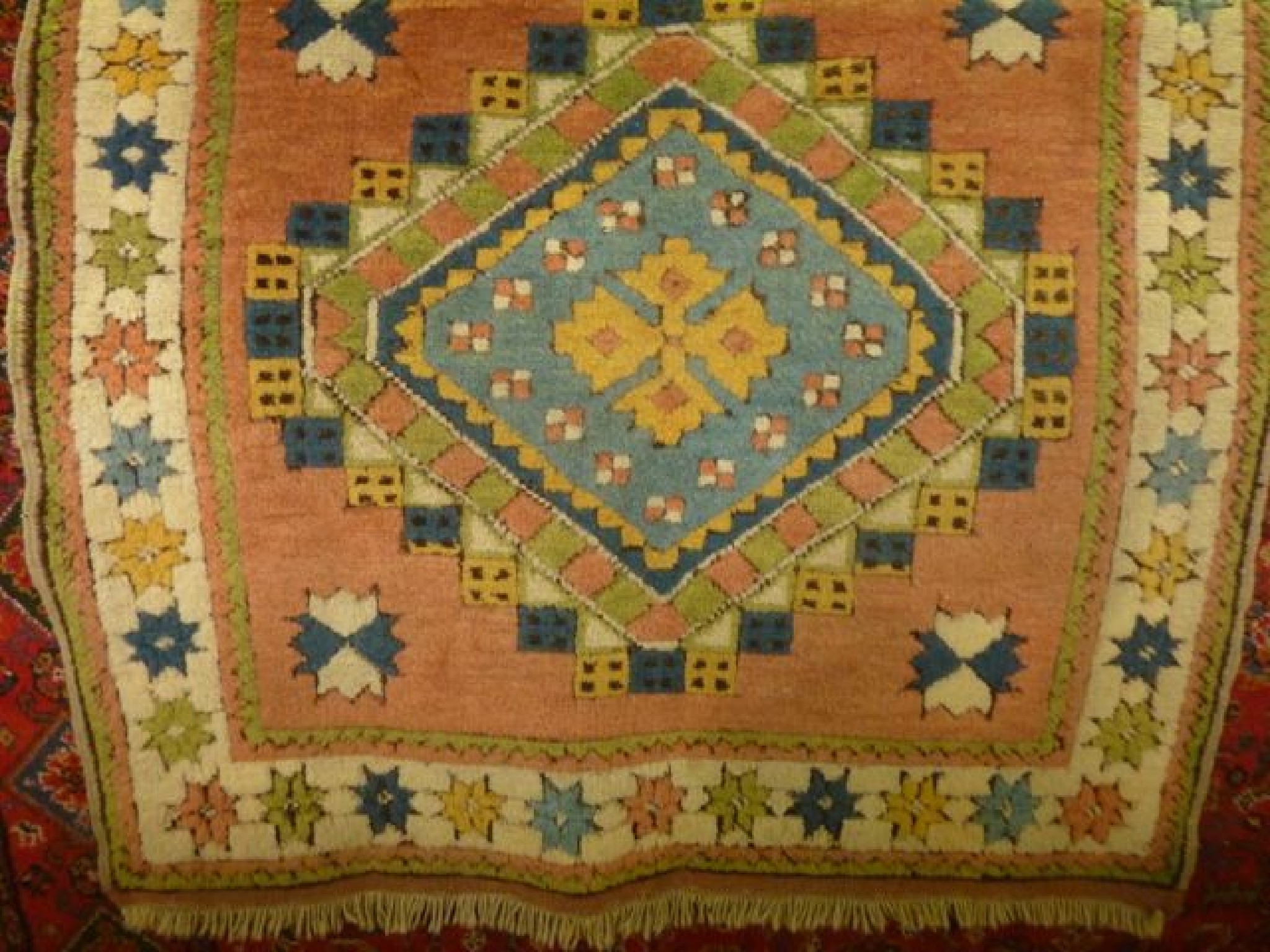 Appraisal: A Turkey wool rug with pastel shade detail with central