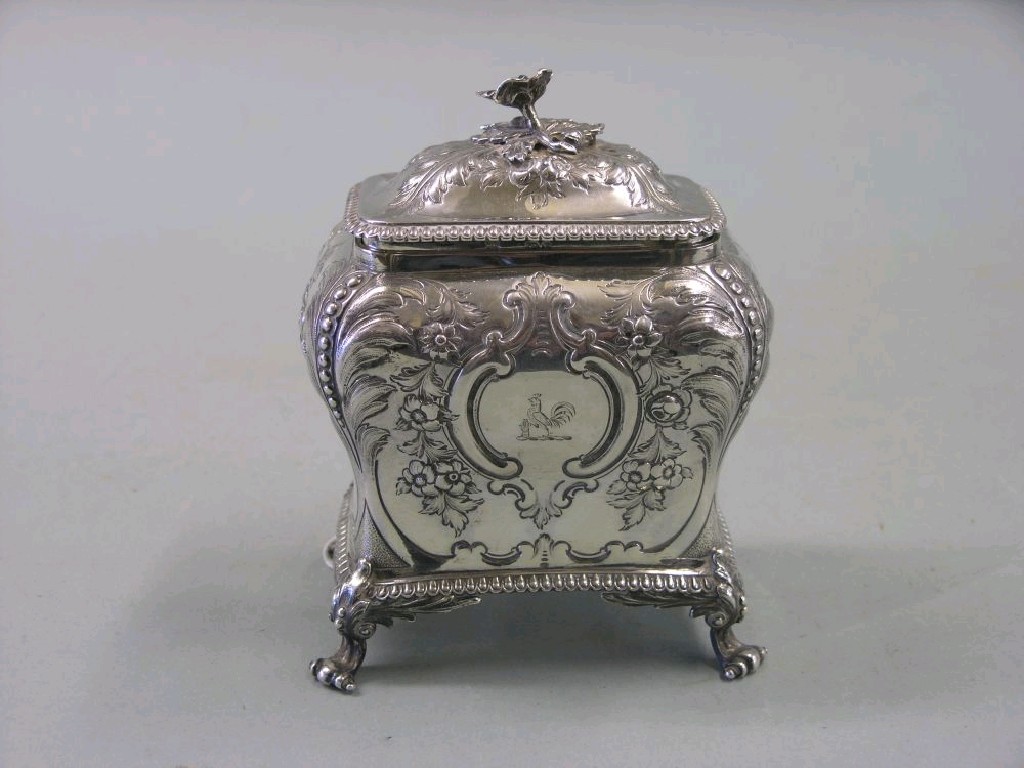 Appraisal: A mid Victorian embossed silver tea caddy bombe-shape with hinged