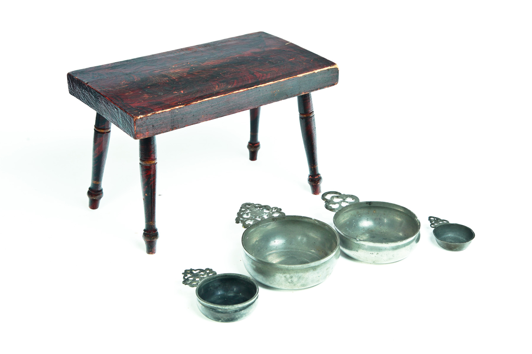 Appraisal: FOUR PEWTER PORRINGERS AND A FOOTSTOOL American th century Four