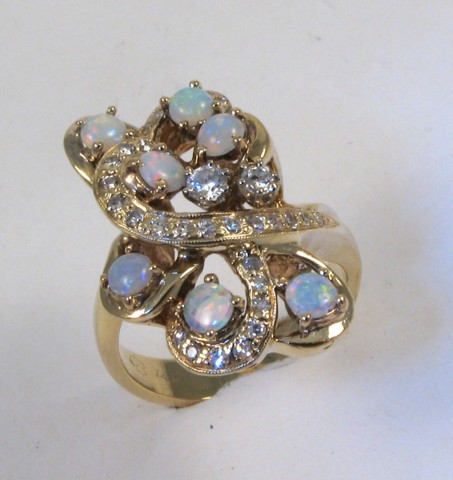 Appraisal: OPAL DIAMOND AND FOURTEEN KARAT GOLD RING set with seven