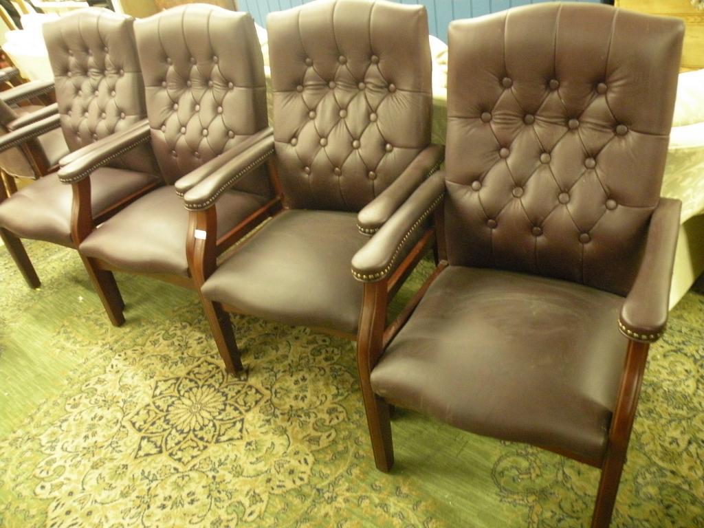 Appraisal: A set of four burgundy leather open armchairs