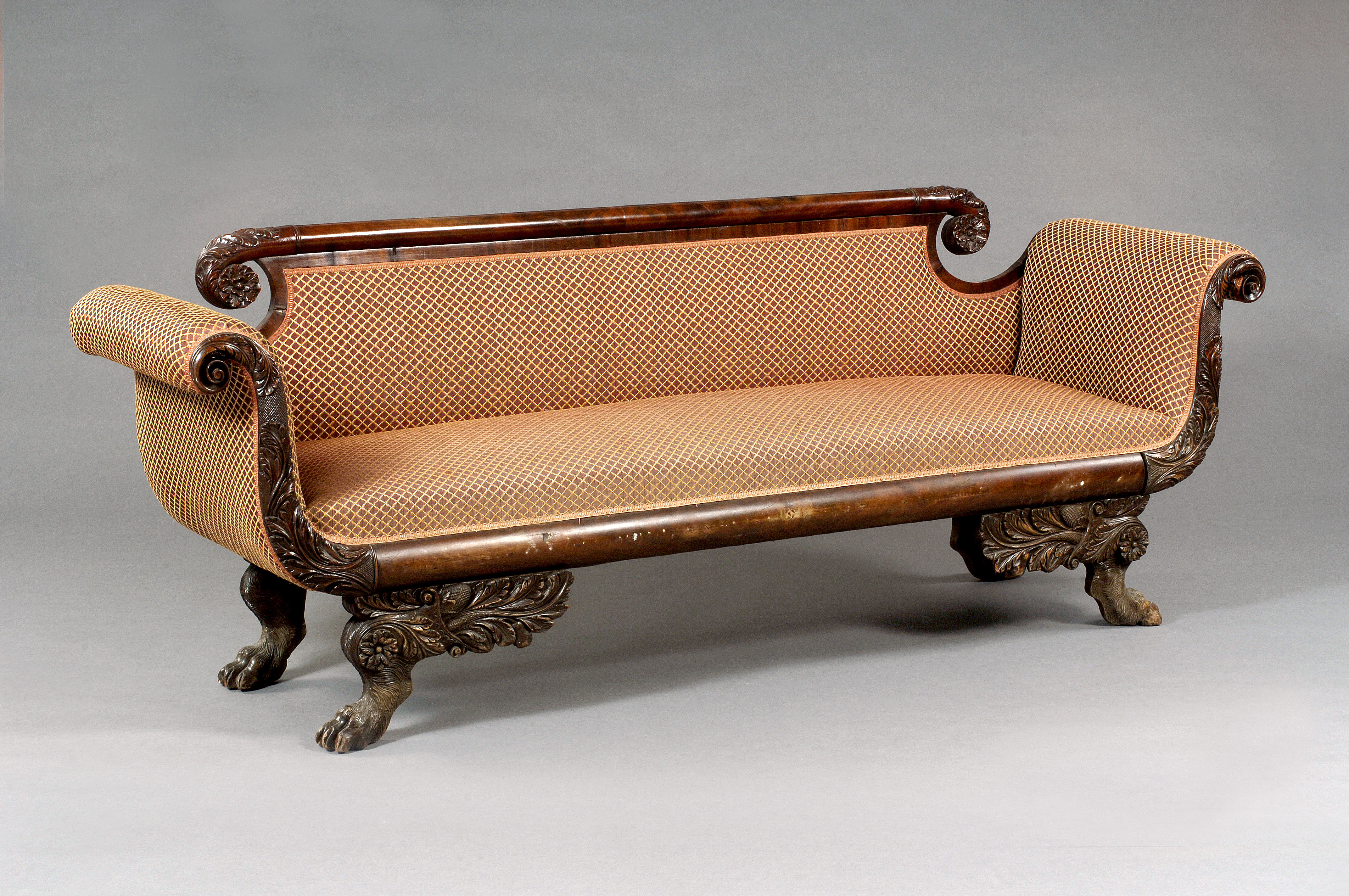 Appraisal: AMERICAN CLASSICAL CARVED SOFA PROBABLY NEW YORK The cylindrical crest