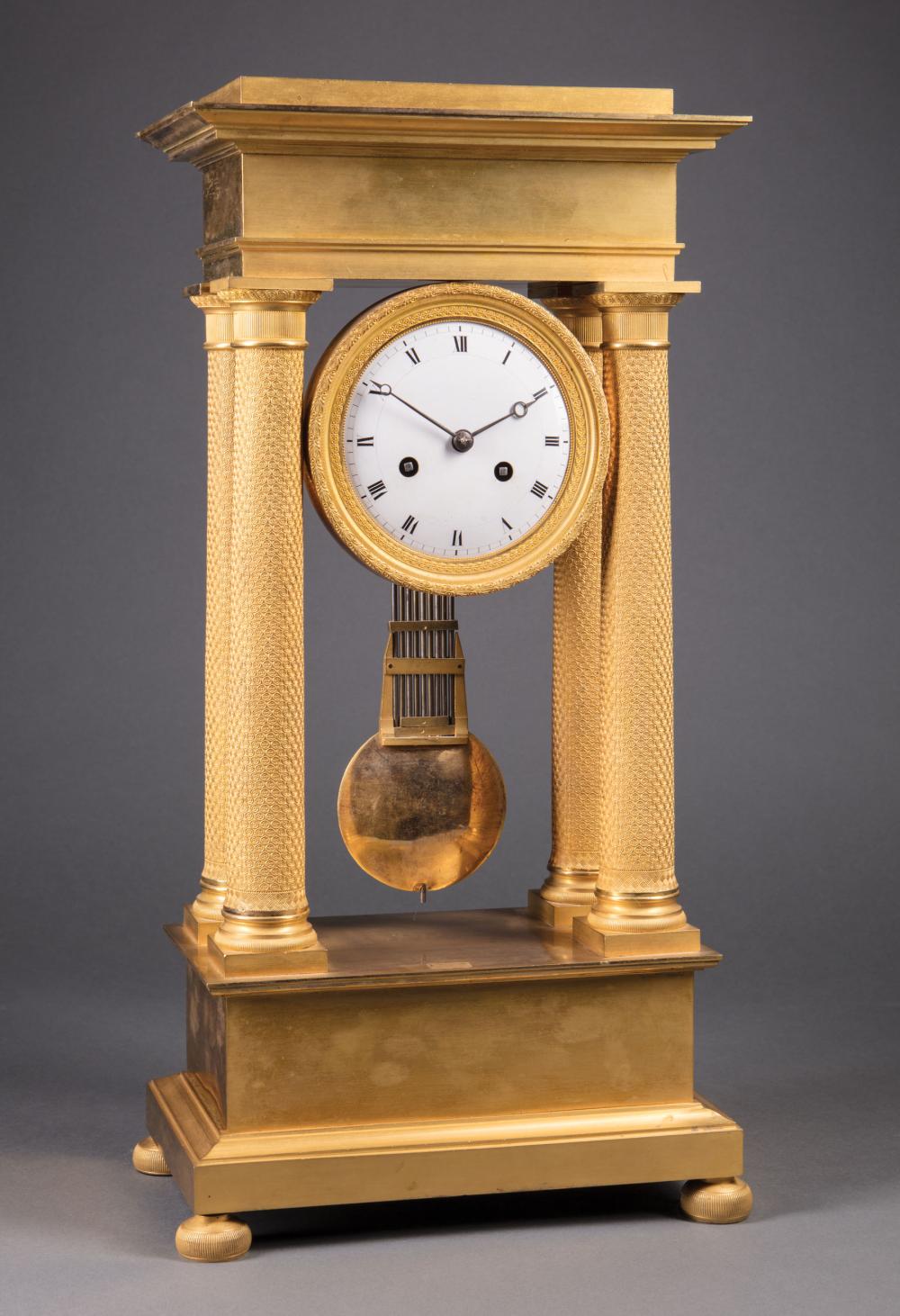 Appraisal: Louis Philippe Gilt Bronze Portico Clock th c rosette and