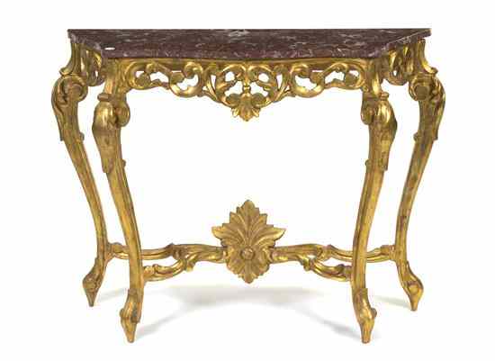 Appraisal: A Giltwood Console Table having scrolling foliate decoration throughout the