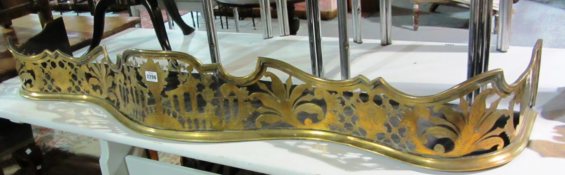 Appraisal: A th century serpentine brass fire curb